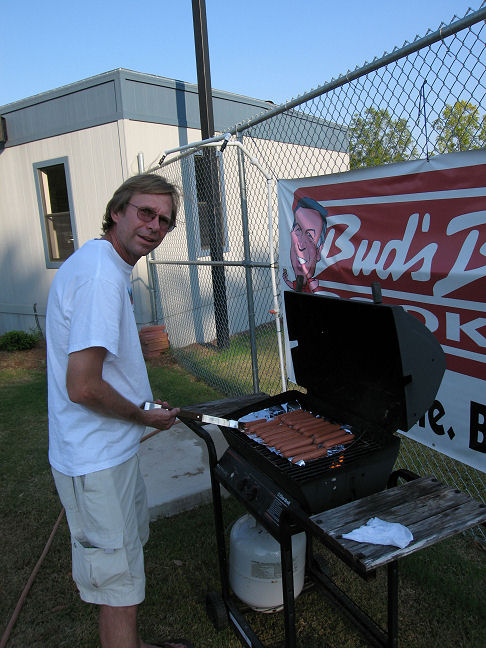 Grill Meister Pat Wachter fires up the hot dogs